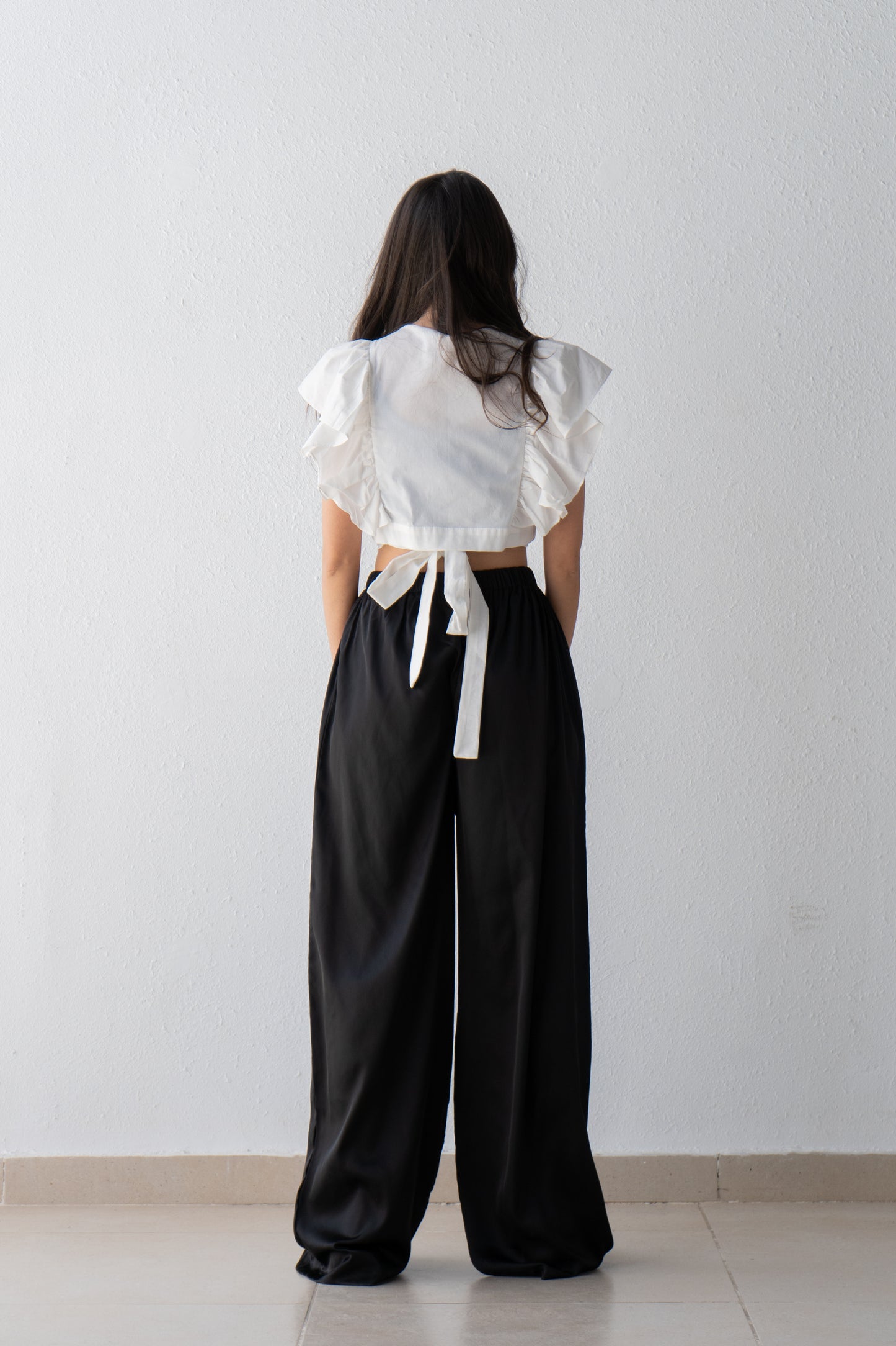 Wrap blouse with shoulder ruffle