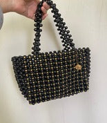 Wooden black bag with gold beads