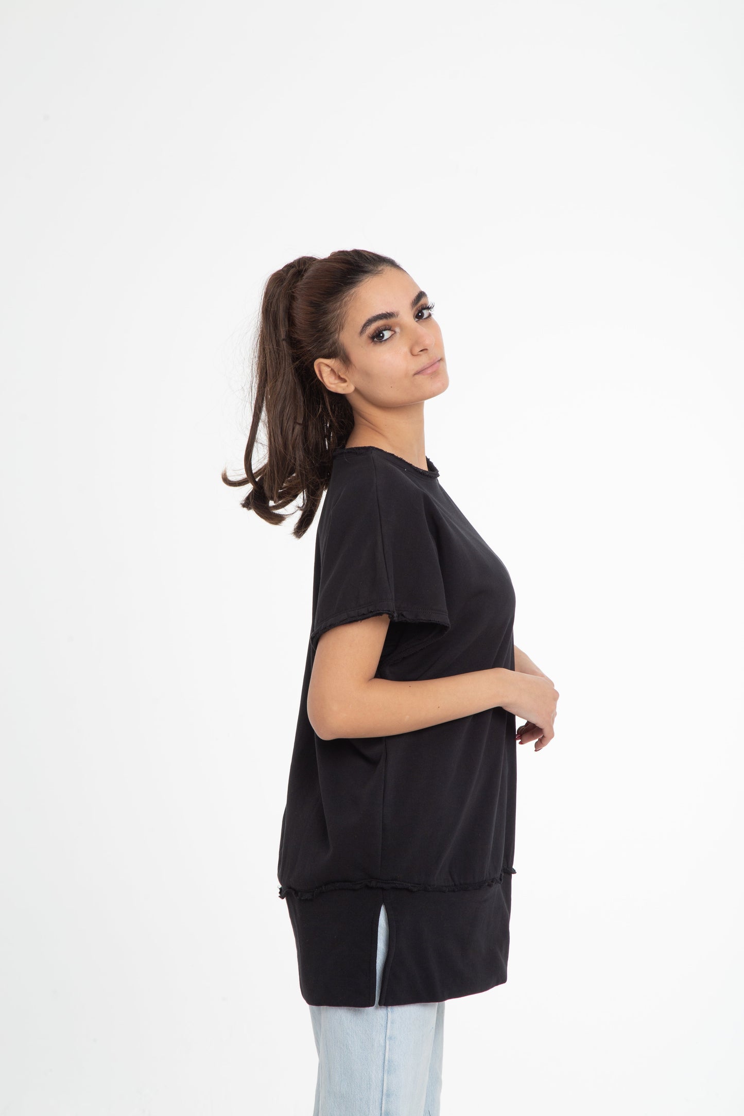 Wide shoulder blouse with raw edges