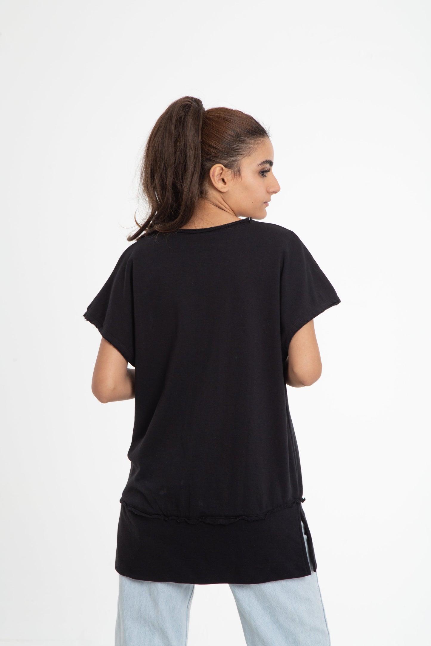 Wide shoulder blouse with raw edges